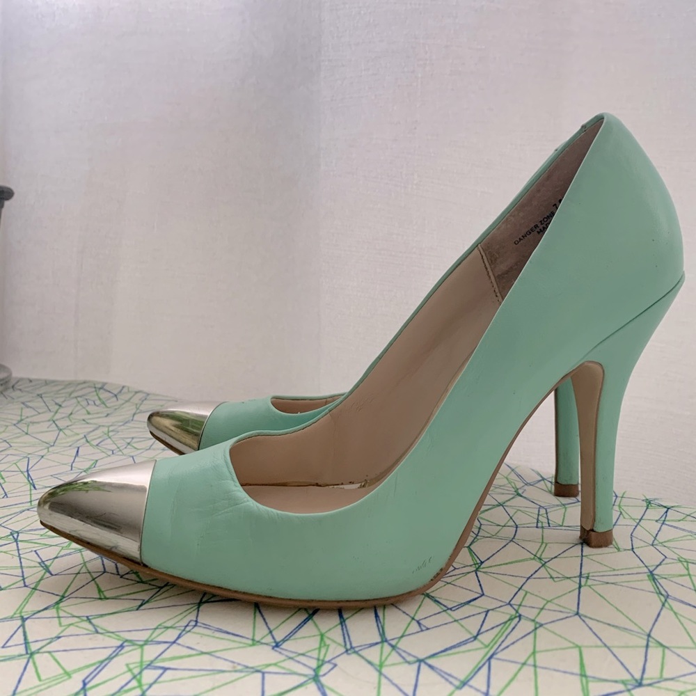 Silver-toe and teal pumps
